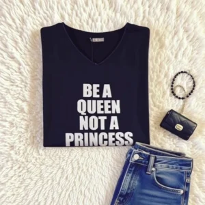 Top noir pour femme, manches longues, flocage "Be a Queen, Not a Princess" en argent pailleté.